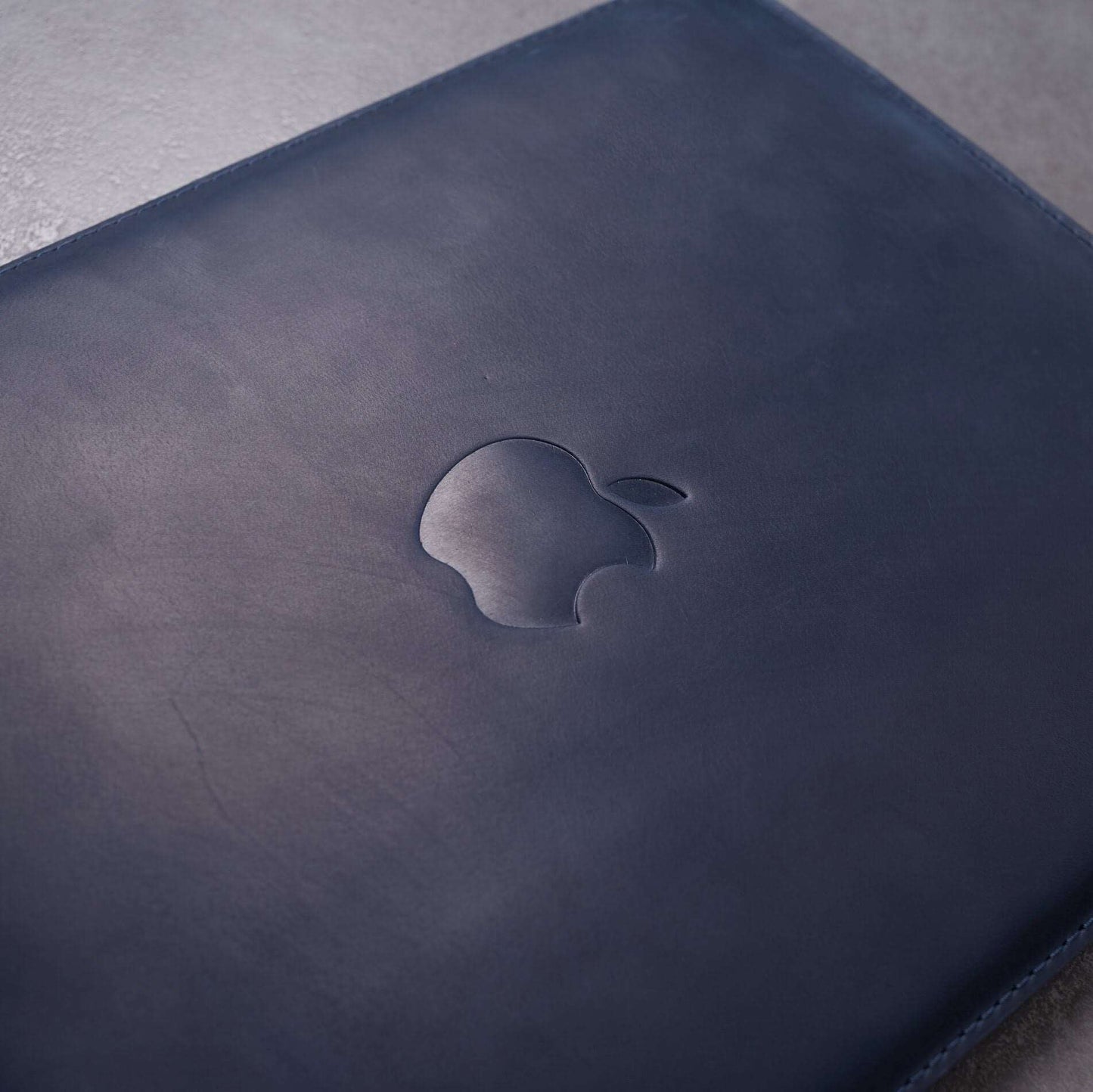 Leather MacBook sleeve with Apple logo