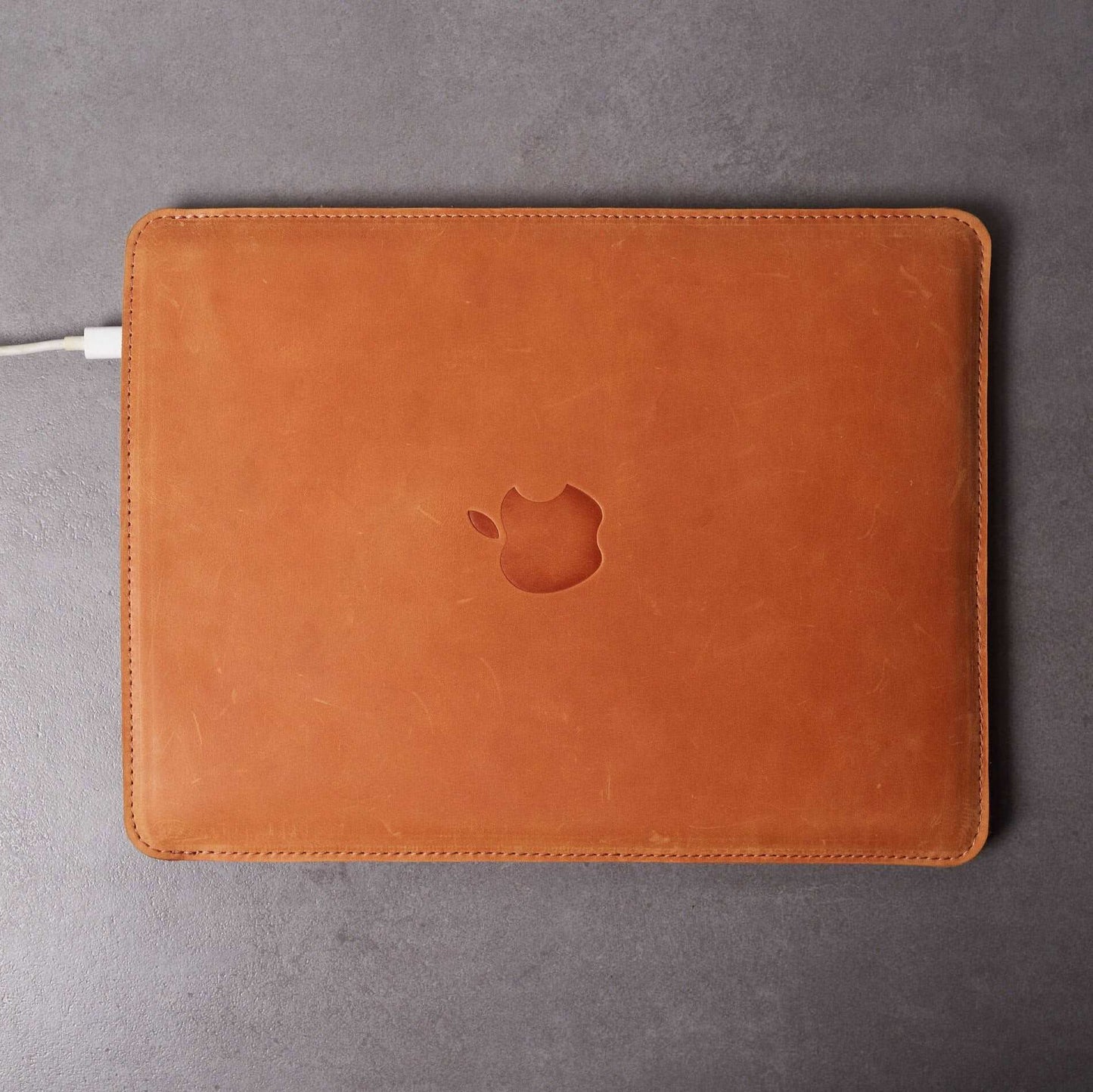 Leather MacBook sleeve with Apple logo