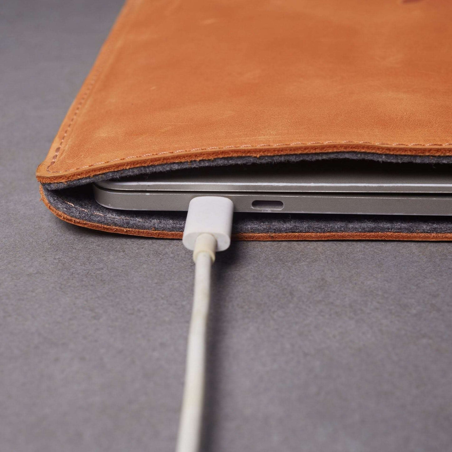 Leather MacBook sleeve with Apple logo